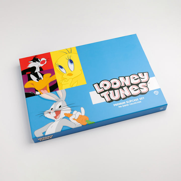 Looney Tunes pin badge box set closed showing front slipcase artwork with Bugs Bunny, Tweety Pie, Daffy Duck and Sylvester illustration