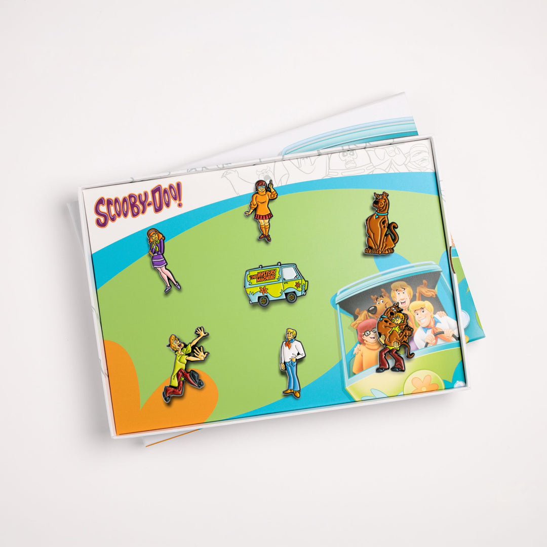 Open Scooby-Doo box set tray displaying all 7 enamel pin badges in insert
