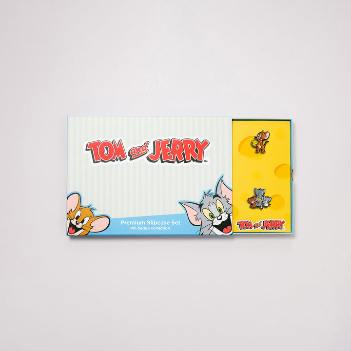 Tom and Jerry pin badge box set with premium slipcase partially open showing enamel pins inside
